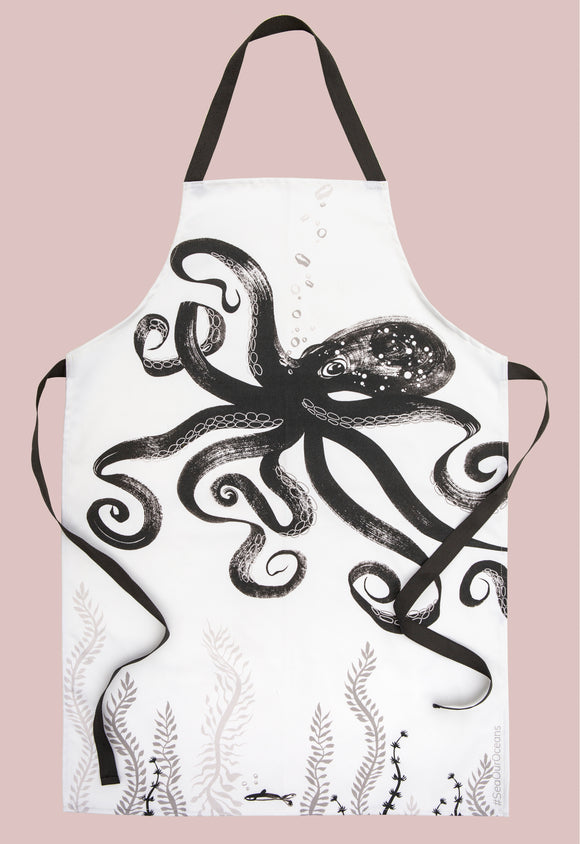 Octopus illustrated white cotton apron with black ties. A black and grey loose brush drawing of a floating octopus