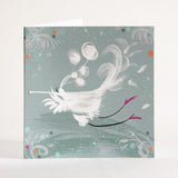 Square card, with a white flute bird playing their flute-like beaks whilst flying in little pink shoes and big feathery tail. Background is a 30's teal colour with mainly white or black brush lines